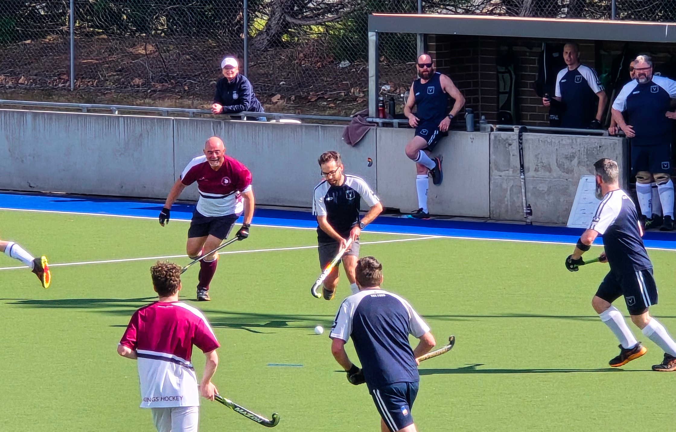 Field hockey players on field, I've got possession of the ball